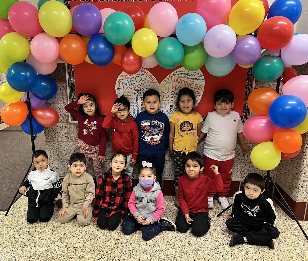 Students under balloon display