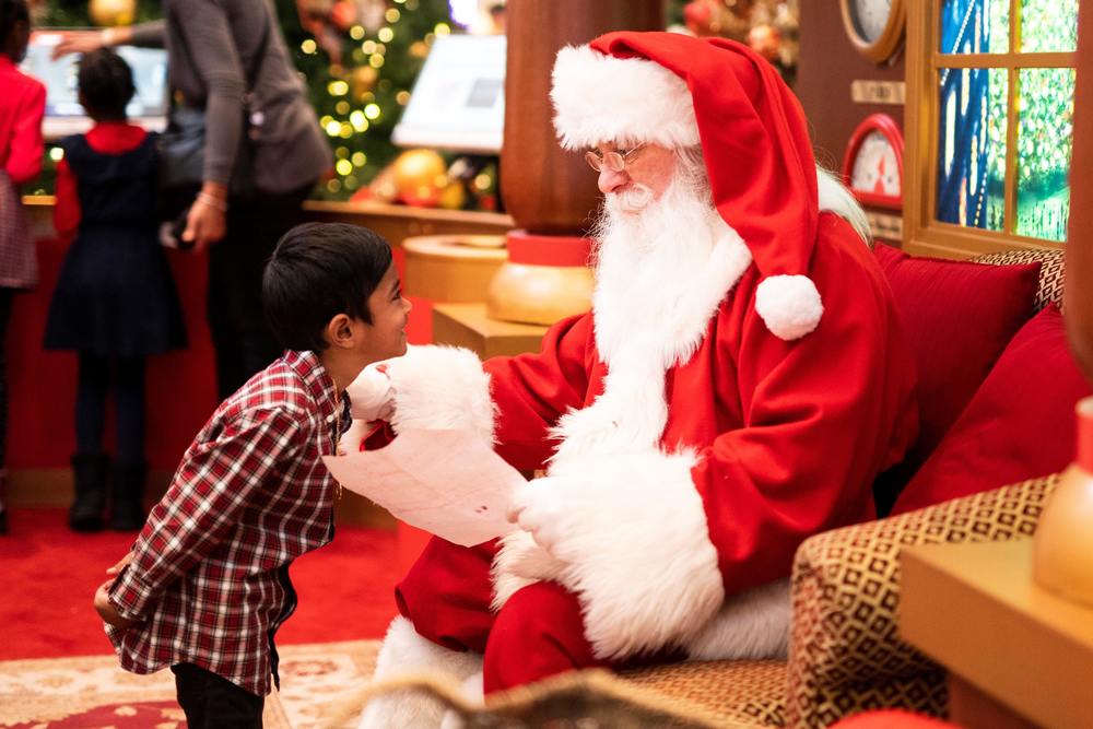 Boy talking to Santa 